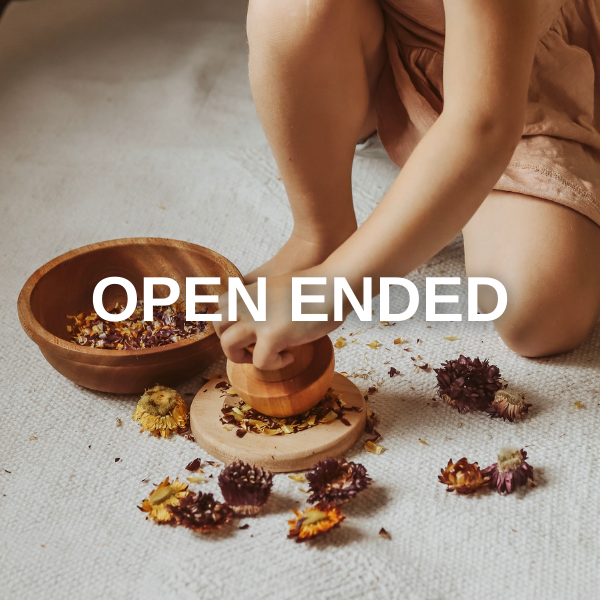 image of a child with open ended toys